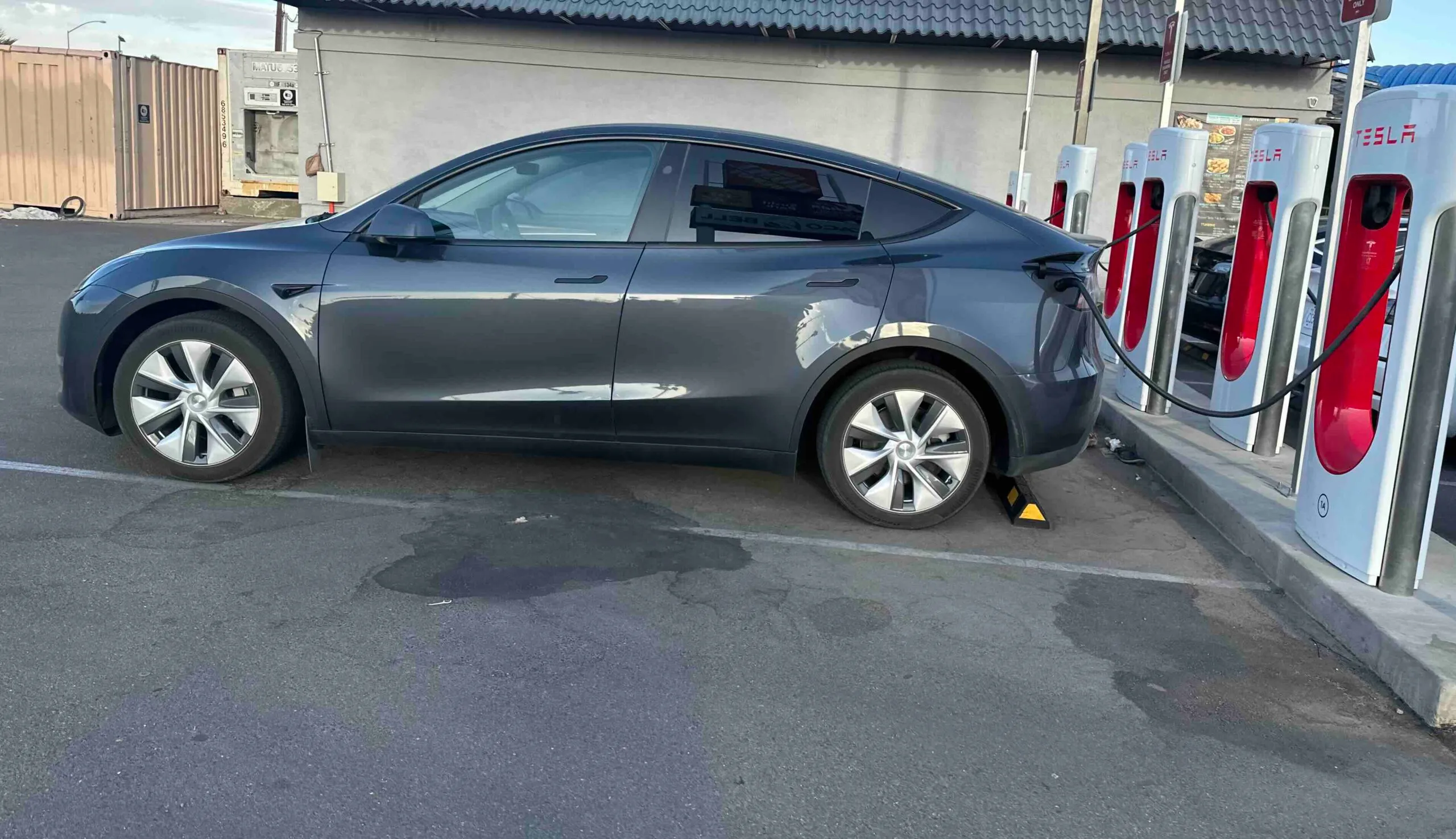 Tesla at a supercharger - EVSE charging station